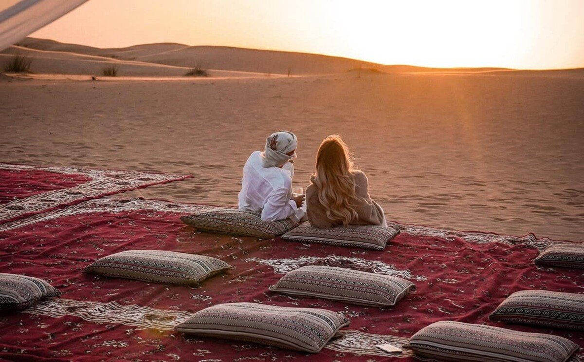 Tourists enjoying Dubai desert with luxury